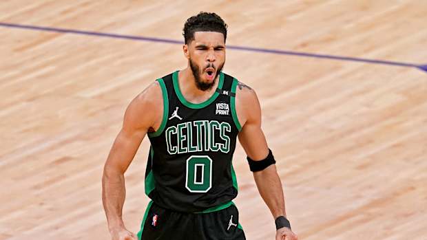 Jayson Tatum celebrates during a game.